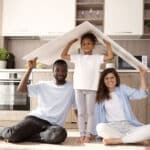 cute-family-holding-roof-their-head