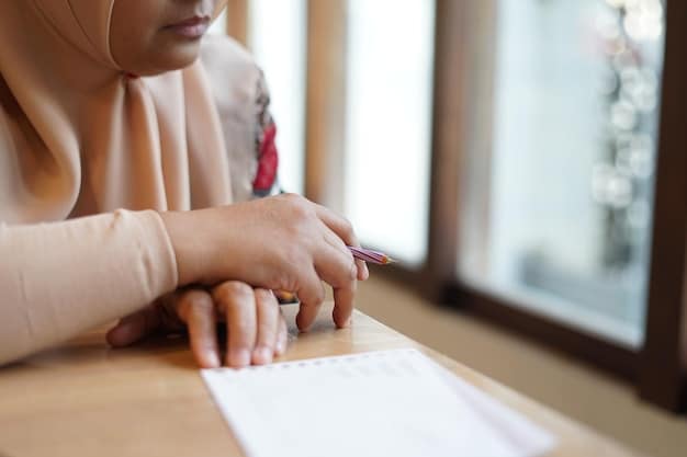 A close-up of a hand signing a student loan forgiveness application form, emphasizing the importance of understanding the application process.