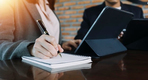 A person reviewing legal documents with the word 
