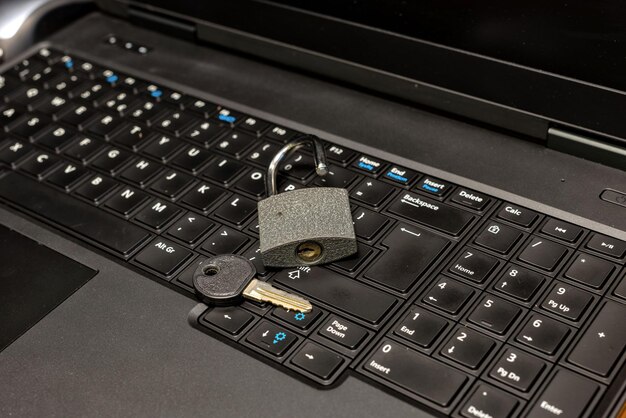 A close-up of a computer keyboard with a padlock icon superimposed on the Enter key, symbolizing increased data security and privacy measures implemented by the government.